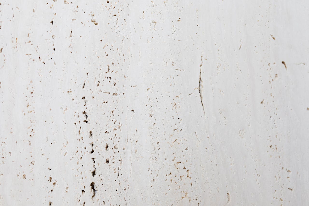 Crafting Captivating Headlines: Your awesome post title goes here A detailed close-up of a white wall texture showcasing natural imperfections and roughness.